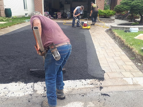 Hand raked asphalt driveways
